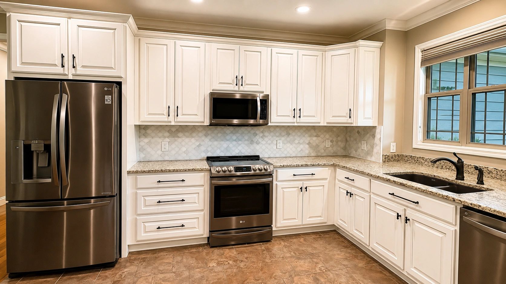 Kitchen cabinet refinishing completed in Ooltewah, TN.  Painted white cabinets and premium finishes.