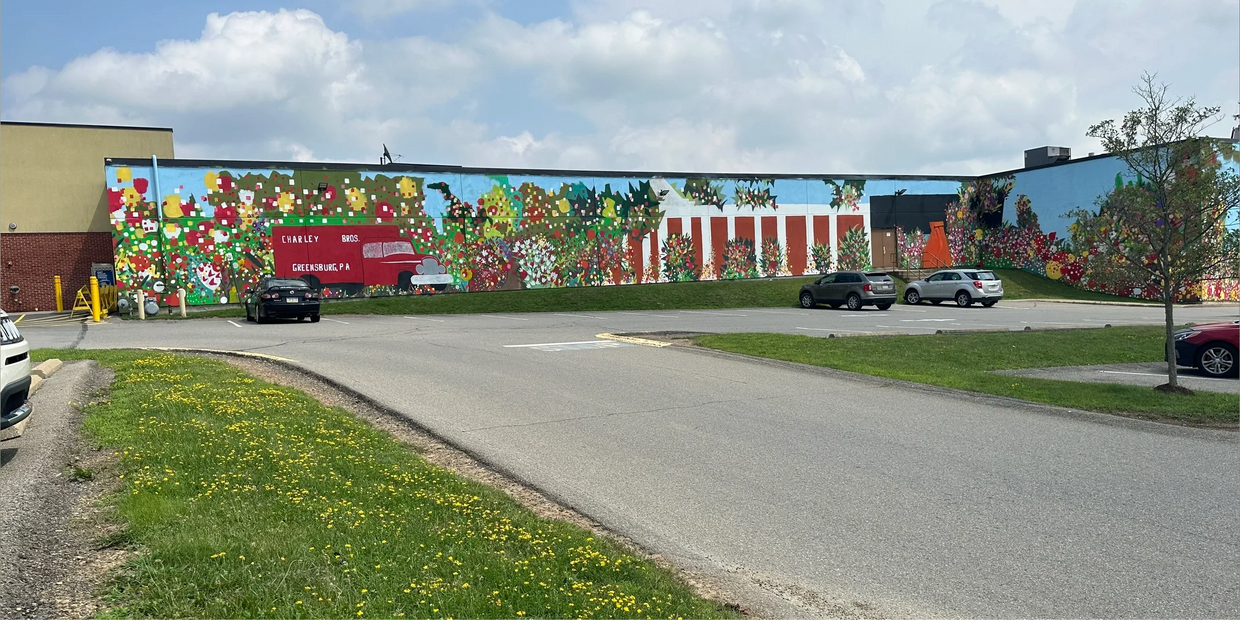 Mural by Rev. Daisher Rocket on the side of Shop n' Save in Greensburg, PA.