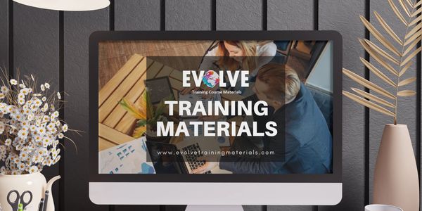 Trainer presenting Evolve PMI-RMP slides to trainees in a classroom for risk management exam prep.