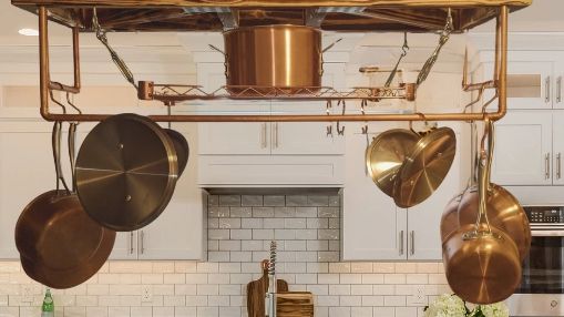 Wood and copper pot rack.