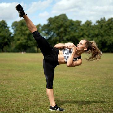 Zara performing a high turning kick.