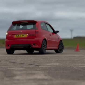 Zara performing a J-turn in a Ford Fiesta ST at DriveTac.