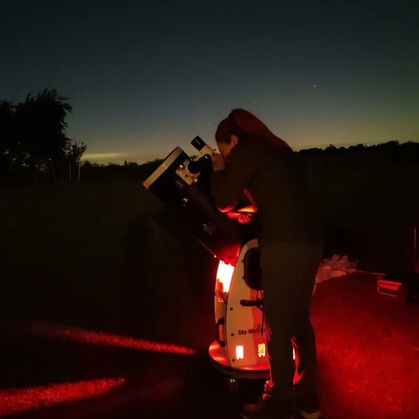A trainee NOVA astronomer using a telescope