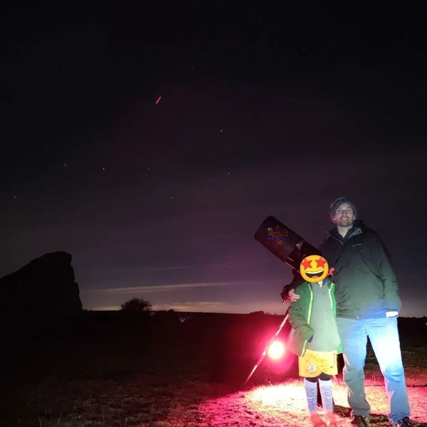 A father and son stargazing on a NOVA stargazing experience in Avebury