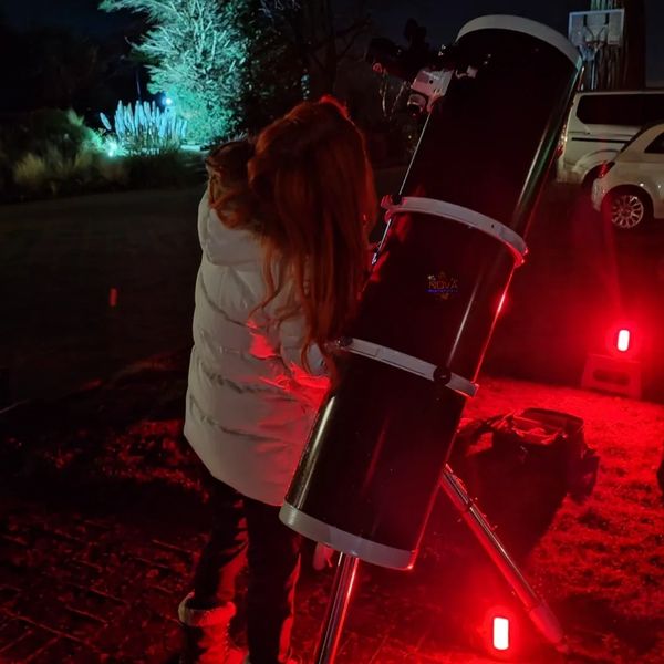 A trainee NOVA astronomer using a telescope 