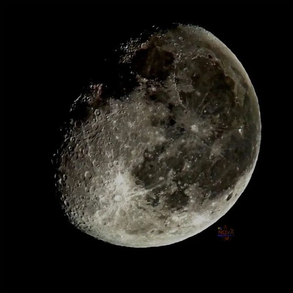 waxing gibbous moon as seen through a telescope