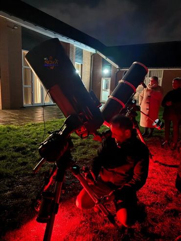 Astronomer with two telescopes