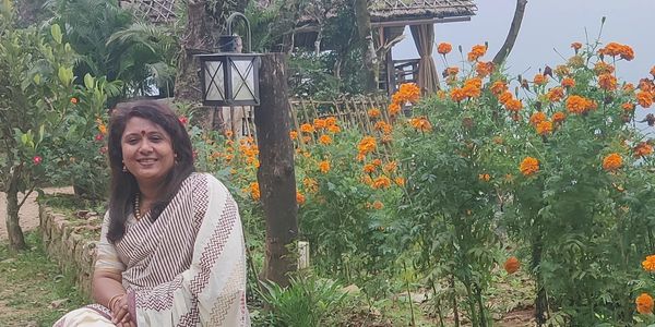 Sunitha, the visionary host of Mountain Villa, passionate about sustainable hospitality and guest experiences in Vagamon.