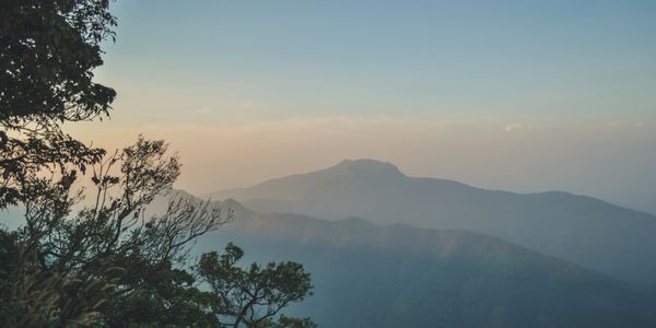 Golden hour sunset over the rolling hills of Vagamon from Mountain Villa’s scenic viewpoint