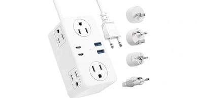 White universal power strip with multiple outlets and international plug adapters.