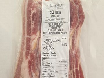 Vacuum-sealed package of side bacon with label and nutrition facts.