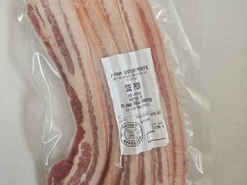 Vacuum-sealed package of side pork from J-Mar Custom Meats.