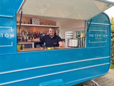 Man standing in a mobile bar