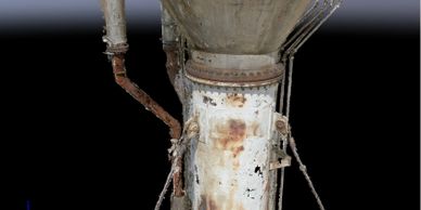 Rusty, old industrial pipe with peeling paint and corroded joints.
