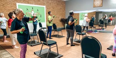 group of senior citizens working out at genes fitness center