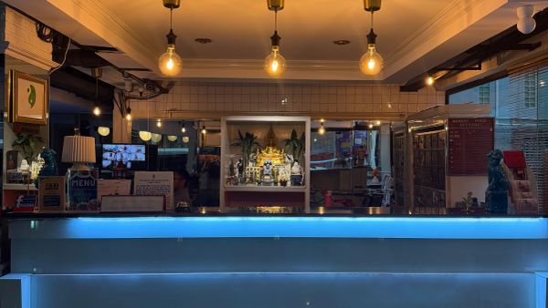Reception desk with warm lighting and decorative elements.