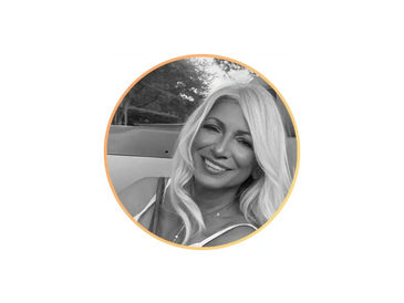 Smiling woman with long blonde hair in a circular frame outdoors.