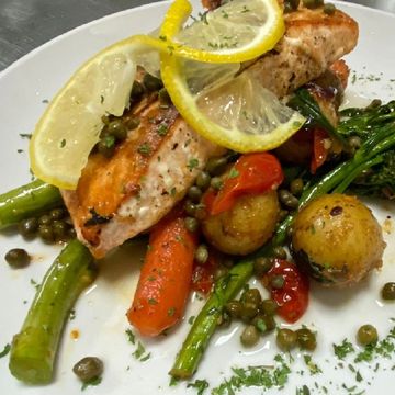 Grilled salmon, broccolini, confetti potato hash, and lemon caper sauce