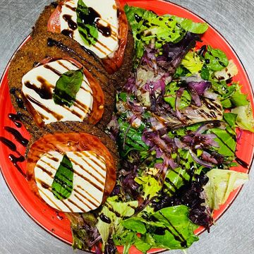 Mix Greens, Slices of Fried Eggplant, Fresh Mozzarella and  Tomatoes with EVOO and Balsamic Drizzle