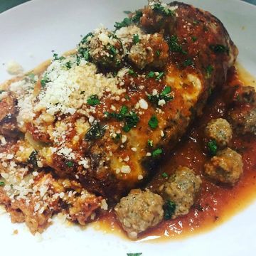 Ricotta, mozzarella and our Sunday sauce with baby meatballs.
