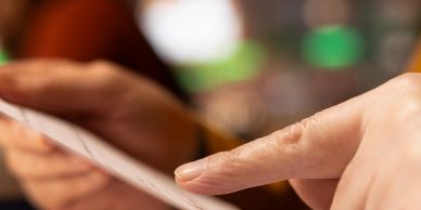 Close-up of a hand using a smartphone.