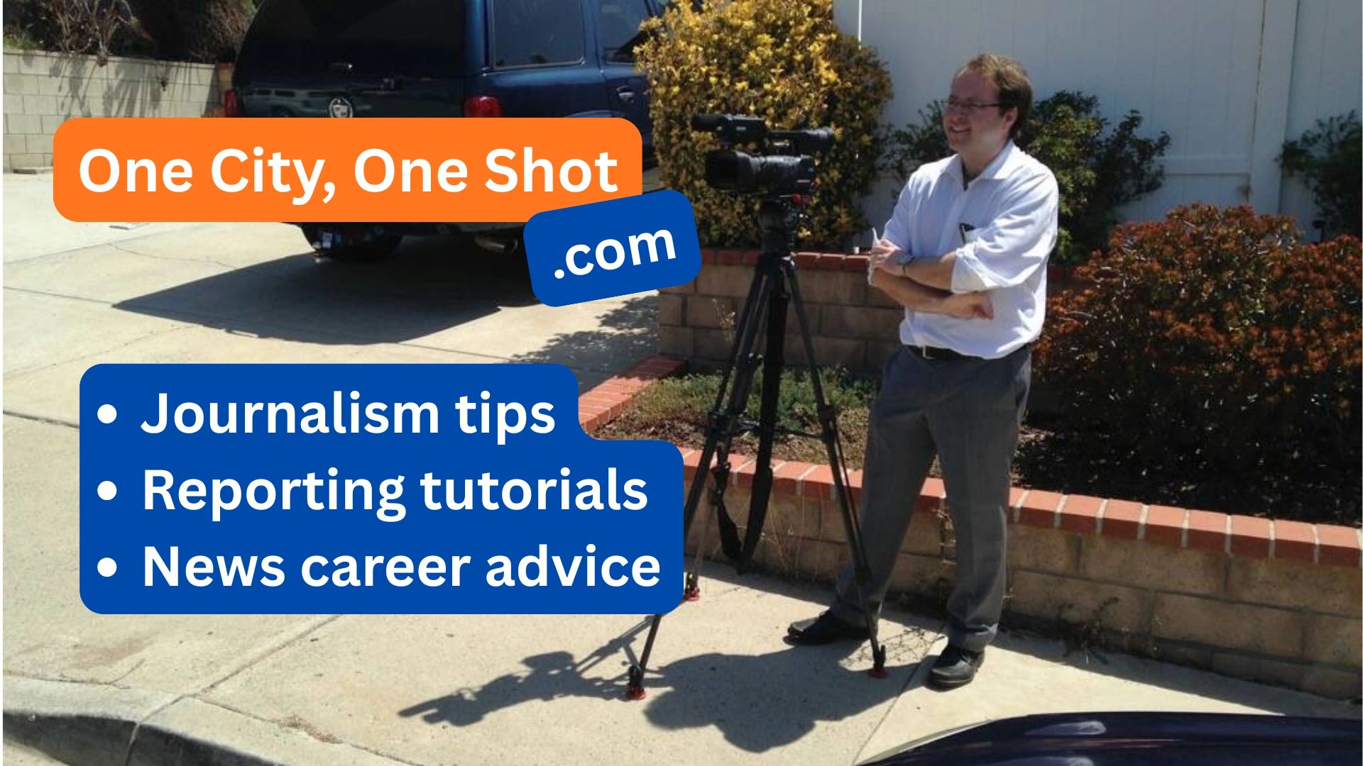 Man standing beside a professional video camera outdoors.