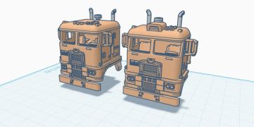 3D models of two vintage truck cabs on a grid platform.