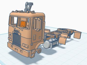 3D model of a truck cab and chassis in progress, displayed on a grid background.