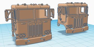 3D models of truck cabs with detailed front grills and headlights.