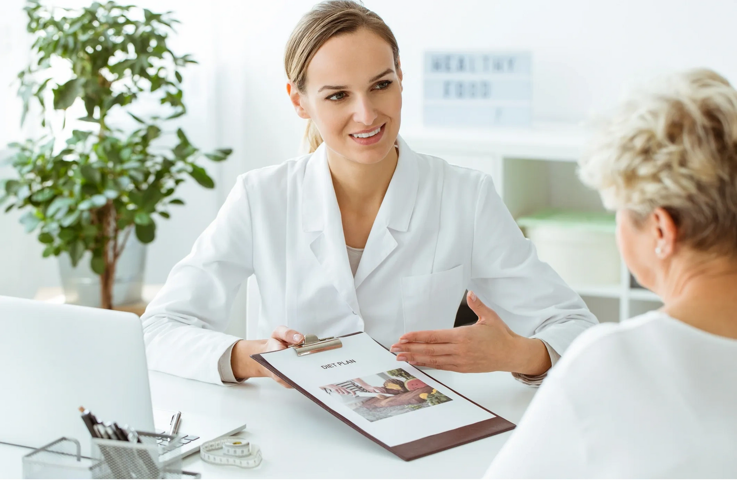 Female doctor discuss with Old woman