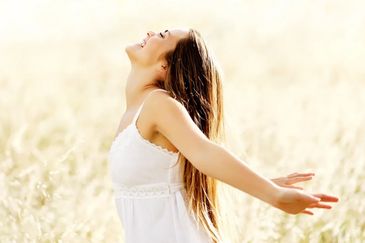 Woman in nature after Life coaching for PTSD Healing at the best life coaching in Laguna Niguel