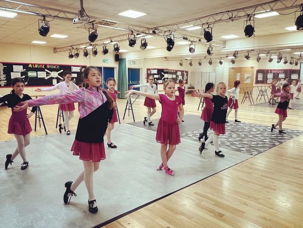 Children learning in a private class tap dancing