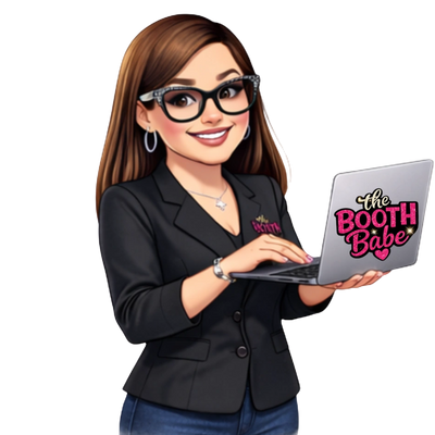 Smiling woman with glasses holding a laptop with 'The Booth Babe' sticker.