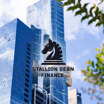 Modern skyscraper with Stallion Dean Finance logo featuring a horse chess piece.