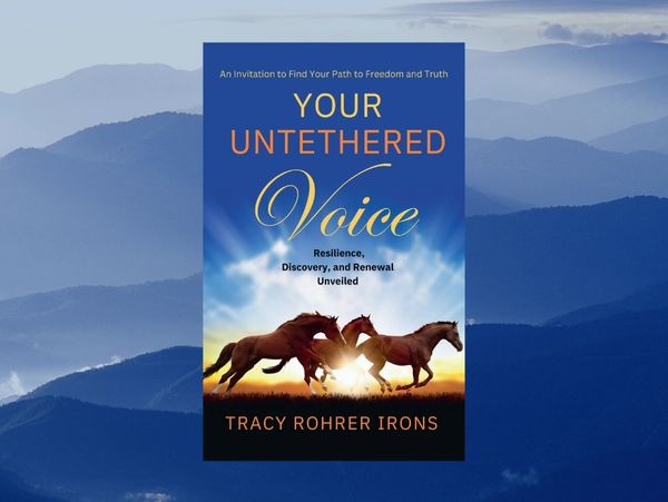Mountainous background with a book in the foreground entitled Your Untethered Voice: Resilience, Dis
