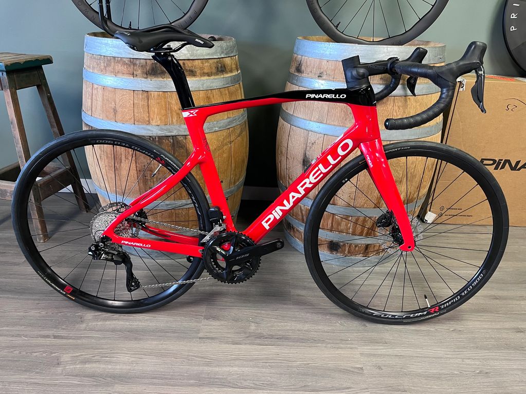 Black Red Pinarello X3 road bike displayed indoors