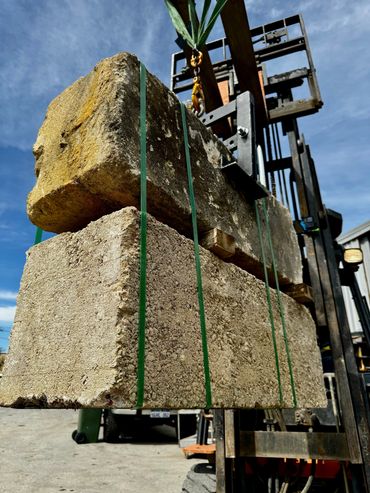 a limestone block lifter lifting 2 limestone blocks at once
