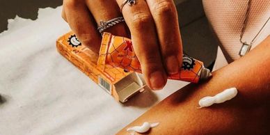 TKTX numbing cream applied on forearm before tattoo session