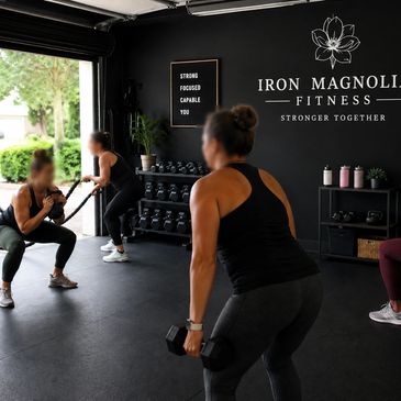 Women working out together at Iron Magnolia Fitness gym.
