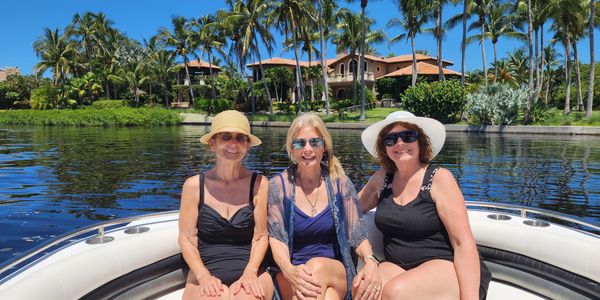 3 women enjoying sunshine and the coast line along the Venice Intra-Coastal Waterway