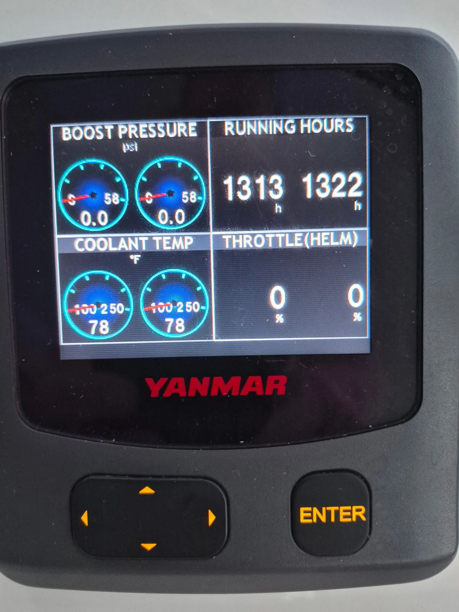 Yanmar engine display showing boost pressure, coolant temperature, running hours, and throttle.