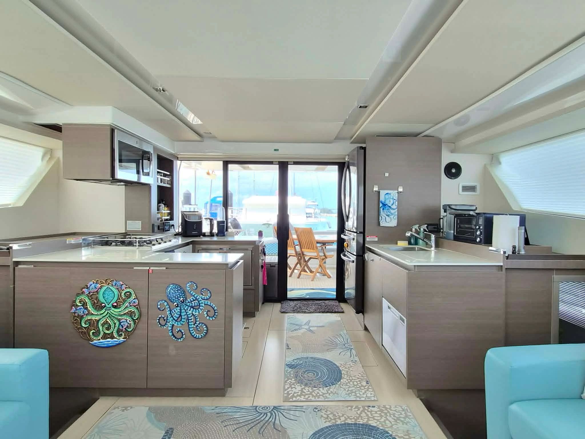 Modern kitchen interior on a yacht with ocean view.