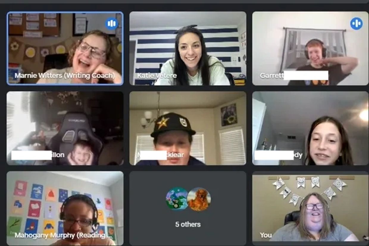 Virtual meeting with smiling participants.