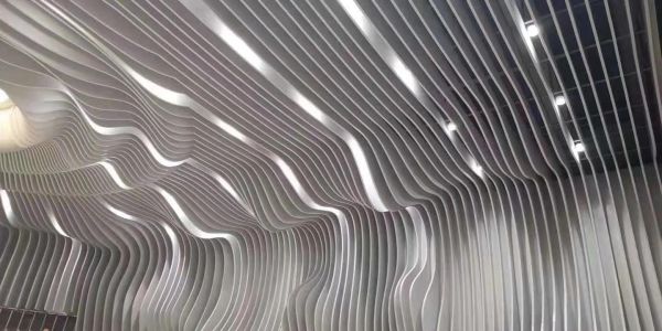 Wavy ceiling design with integrated lighting.
