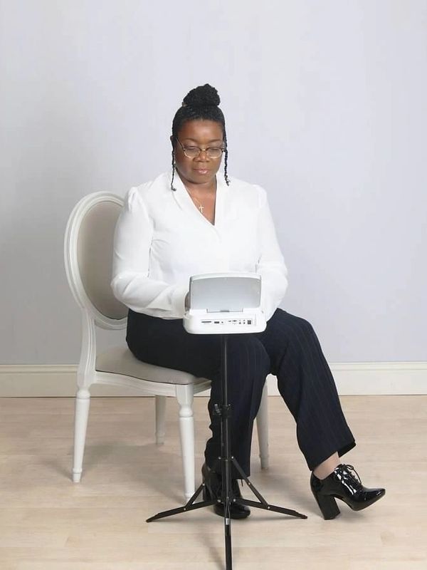 Angela E. Denmark, RPR, working at her steno machine.