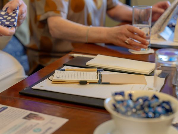 Corporate boardroom workshop focused on evidence-based workplace wellbeing by Tranquility Wellbeing.