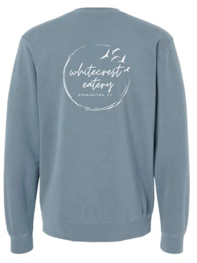 Blue sweatshirt with 'whitecrest eatery' logo and birds design on the back.
