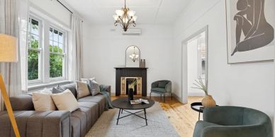 Bright and cozy living room with modern furniture and large windows.