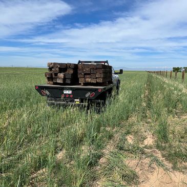 Number 2 railroad ties being used for fencing