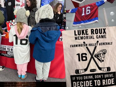 Children at a memorial game booth promoting safe driving and honoring Luke Roux.